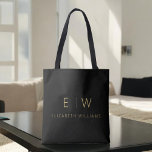 Classic Black Gold Minimalist Monogram Name Tote Bag<br><div class="desc">Elevate your style with our Classic Elegant Modern Minimalist Monogram Tote Bag. This versatile tote seamlessly blends timeless sophistication with contemporary minimalism, making it an essential accessory for any occasion. Designed with meticulous attention to detail, this tote bag is more than just a practical accessory; it's a personalized fashion statement....</div>