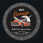 Classic Chevy Truck Garage Dad's Any Name Black Large Clock<br><div class="desc">Dad's or any name garage with 50's Chevy on a black background with orange script and a gray border. Just use the personalize this template option to change the text. Funny slogan typography with any date. Just choose the hand color and size.</div>