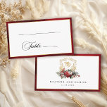 Classic Christmas Floral Crest Monogram Wedding Place Card<br><div class="desc">Timeless and elegant yet festive holiday-themed wedding place card design featuring classic hand-drawn gold floral crest accented by a colorful spray of red and white Christmas flowers and evergreens. This custom formal template includes editable text fields for guest name and table number as well as custom calligraphy text graphics and...</div>