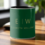 Classic Emerald Green Gold Minimalist Monogram Two-Tone Coffee Mug<br><div class="desc">Enjoy your favorite drink with this classic emerald green gold minimalist monogram two-tone coffee mug. Featuring a rich emerald green background, elegant gold typography, and a sleek modern layout, this personalized mug combines timeless luxury with everyday style. Perfect as a wedding gift, anniversary present, corporate giveaway, or a chic addition...</div>