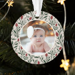 Classic Floral Frame Baby's First Christmas Ornament<br><div class="desc">This beautiful Baby's First Christmas holiday photo ornament features a hand drawn floral and greenery pattern in classic, traditional Christmas colors of deep green, burgundy red, and ivory over a custom color background (shown in light sand beige). A small ivory colored frame allows your photo to stand out against the...</div>