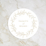 Classic Gold Greenery Wedding Round Paper Coaster<br><div class="desc">Introducing our Classic Gold Greenery Wedding Round Paper Coaster Design- meticulously designed to embody a modern romantic aesthetic. Featuring a classic blend of clean white backgrounds with delicate golden leaves gracefully complemented by a simple calligraphy script paired with an understated serif font. The result is a perfectly polished feel for...</div>