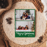 Classic Green Merry Christmas Vertical 2 Photo Holiday Card<br><div class="desc">Celebrate the season with this unique, classic green Merry Christmas vertical 2 photo holiday card featuring a touch of vintage charm. The minimalist design showcases an elegant green and white color palette, evoking the cozy spirit of winter. Its modern and fun appeal, paired with the traditional wording, creates a perfect...</div>
