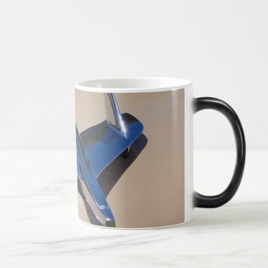 classic hood ornament with beigh background magic mug