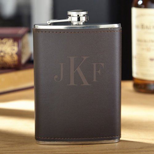 Classic Monogram Fitzgerald Personalized Flask - Simplicity and refinement are qualities to be honored and cherished. Our Fitzgerald personalized leather flask is the definition of a to-the-point drinking accessory. Wrapped in durable dark brown leather, this personalized flask is crafted from stainless, rust-resistant steel and makes an excellent gift for groomsmen, retirees, or minimalist liquor enthusiasts who enjoy the craftsmanship of a well-made product. Enjoy your spirits discretely and stylishly with our impressive Classic Monogram Fitzgerald personalized flask. This leather flask measures 4" x 1" x 6" and can hold up to 8 ounces.