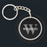 Classic Monogram: Personalized Black, White, and G Keychain<br><div class="desc">Introducing our "Classic Monogram" Keychain – a perfect blend of elegance and functionality. This sophisticated accessory is designed for those who appreciate a classic style with a personal touch. Its elegant black, white, and grey color scheme exudes a timeless sophistication that complements any set of keys. Personalize this keychain with...</div>