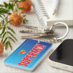 Classic Superman Bold Logo Keychain<br><div class="desc">Bring timeless superhero energy to your style with this striking Superman design! Featuring the bold red “SUPERMAN” text with a silhouette of the Man of Steel heroically posed within the lettering, this artwork pops against a sleek gradient blue background. Topped with the iconic red and yellow “S” shield, it’s a...</div>