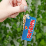 Classic Superman Bold Logo Keychain<br><div class="desc">Bring timeless superhero energy to your style with this striking Superman design! Featuring the bold red “SUPERMAN” text with a silhouette of the Man of Steel heroically posed within the lettering, this artwork pops against a sleek gradient blue background. Topped with the iconic red and yellow “S” shield, it’s a...</div>
