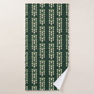 Classical vases and greenery on a dark green bath towel