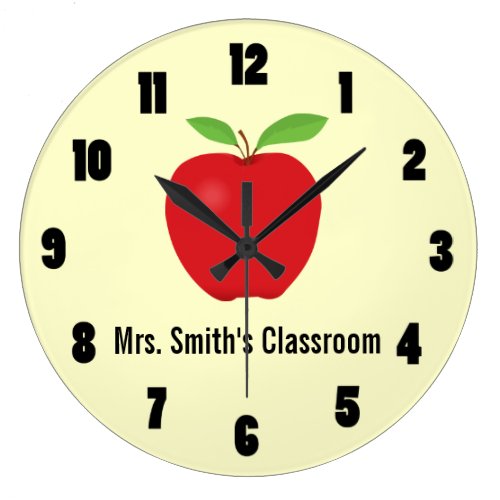 Classroom Clock with an Apple - This clock has a light yellow background with a graphic of an apple on the top and room for text below that apple. The text shown here is "Mrs. Smith's Classroom". The clock can be customized to fit your needs. This would make a great gift for a teacher.