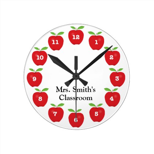 Classroom Clock with Apples - This classroom clock offers red apples on a white background.  Each number is on an apple around the clock. Personalize this fun clock with the teacher's name.