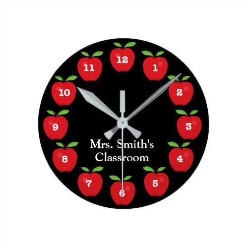 Classroom Clock with Apples on Black - This classroom clock offers red apples on a black background.  Each number is on an apple around the clock. Personalize this fun clock with the teacher's name.