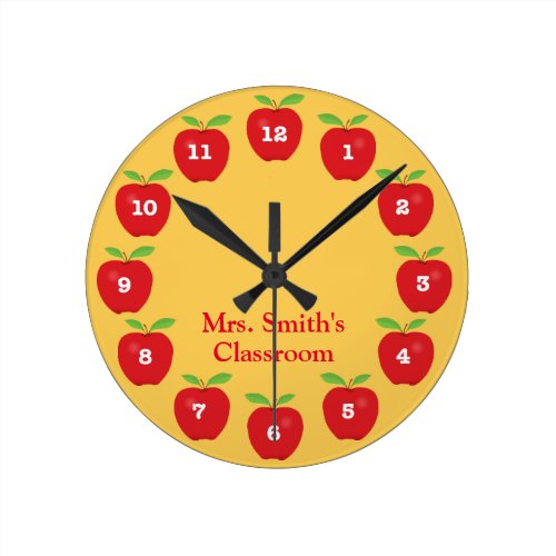 Classroom Clock with Apples on Yellow - This classroom clock offers red apples on a golden yellow background.  Each number is on an apple around the clock. Personalize this fun clock with the teacher's name.