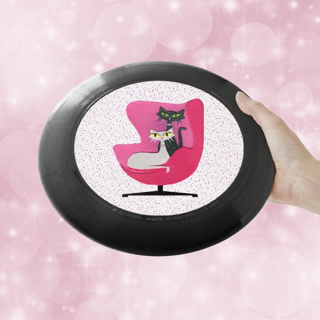 Classy Cats 1950's Theme Pink Chair Polka Dots Wham-O Frisbee (Black and white cats sitting in 1950's style pink chair on white with pink polka dots frisbee.)