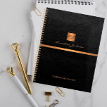 Classy elegant black leather gold monogrammed planner<br><div class="desc">Luxury exclusive looking office or personal monogrammed planner featuring a faux copper metallic gold glitter square with your monogram name initials and a sparkling stripe over a stylish black faux leather background. Suitable for small business, corporate or independent business professionals, personal branding or stylists specialists, makeup artists or beauty salons,...</div>
