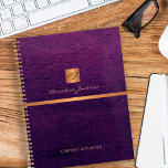Classy elegant purple leather gold monogrammed planner<br><div class="desc">Luxury exclusive looking office or personal monogrammed planner featuring a faux copper metallic gold glitter square with your monogram name initials and a sparkling stripe over a stylish purple indigo faux leather background. Suitable for small business, corporate or independent business professionals, personal branding or stylists specialists, makeup artists or beauty...</div>