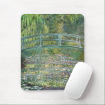 Claude Monet Japanese Bridge Water Lily Art Mouse Pad<br><div class="desc">"The Water-Lily Pond" (1899) is one of the most beloved masterpieces by Claude Monet, the pioneer of French Impressionism. This iconic painting depicts the serene beauty of his private garden in Giverny. A gracefully arched Japanese wooden bridge spans a tranquil pond covered in blooming water lilies. Monet masterfully uses a...</div>