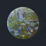 Claude Monet Water Lilies 1915 Impressionist Art Button<br><div class="desc">"Water Lilies" (1915) is a stunning example of Claude Monet’s late-period mastery at his Giverny garden. This iconic Impressionist painting focuses on the serene surface of his lily pond, where vibrant green pads and delicate blossoms in pink and white float upon deep, shimmering blue water. Monet’s expressive, loose brushwork captures...</div>