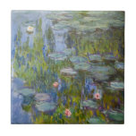 Claude Monet Water Lilies 1915 Impressionist Art Ceramic Tile<br><div class="desc">"Water Lilies" (1915) is a stunning example of Claude Monet’s late-period mastery at his Giverny garden. This iconic Impressionist painting focuses on the serene surface of his lily pond, where vibrant green pads and delicate blossoms in pink and white float upon deep, shimmering blue water. Monet’s expressive, loose brushwork captures...</div>