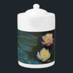Claude Monet Water Lilies Impressionist Oil Art Teapot<br><div class="desc">Indulge in the serene beauty of Claude Monet’s "Nymphéas" (Water Lilies), a masterpiece of French Impressionism. This enchanting design captures the shimmering reflections and delicate yellow blossoms floating atop a deep green pond. Monet’s masterful brushwork and poetic use of light evoke a sense of peaceful tranquility and timeless elegance. This...</div>