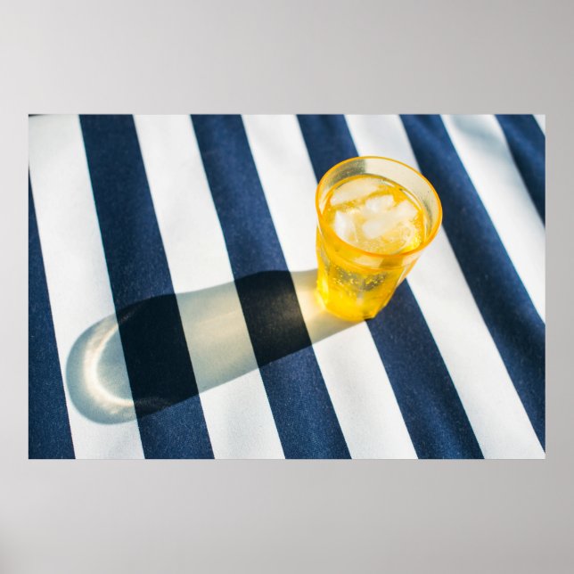 Clear drinking glass with yellow liquid poster (Front)