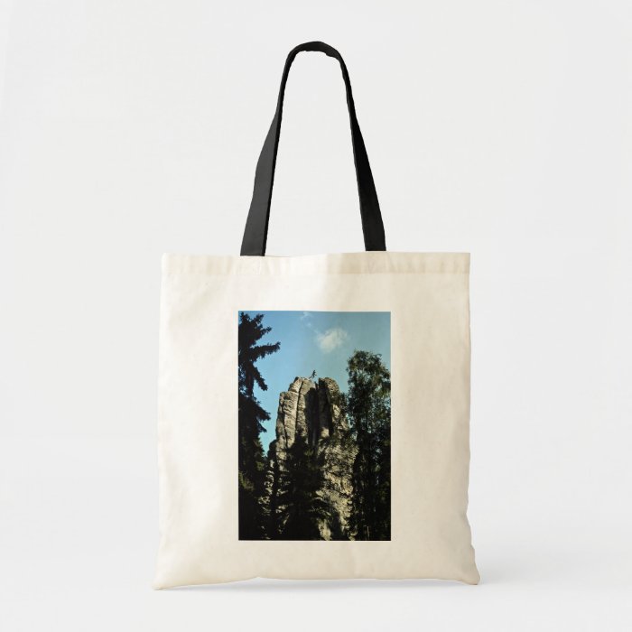 Climber jumping one rock top to another, Czec Tote Bags