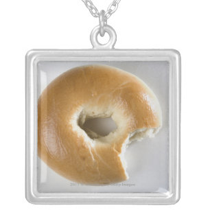 Close-up of a bagel silver plated necklace