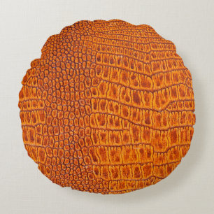 Close up of a brown reptile vintage leather textur round pillow