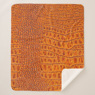 Close up of a brown reptile vintage leather textur sherpa blanket