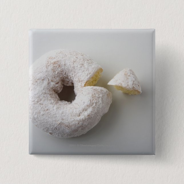 Close-up of a cake pinback button (Front)