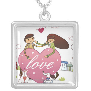 Close-up of a couple holding a heart shape silver plated necklace