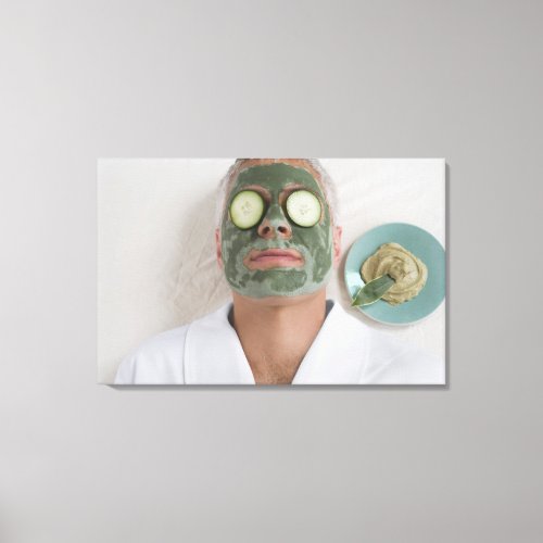 Close_up of a mature man lying down with a face canvas print