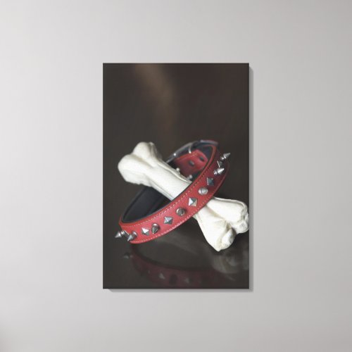 Close_up of a pet collar and a dog bone canvas print