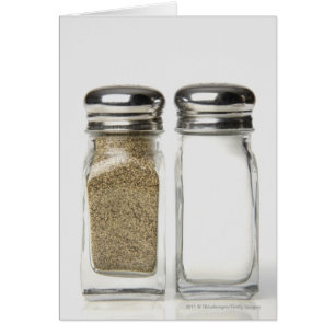 Close-up of a salt and a pepper shaker cards
