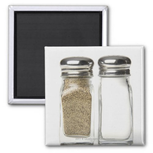 Close_up of a salt and a pepper shaker magnet