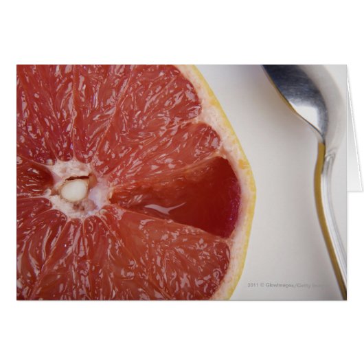 Close-up of a slice of orange and a spoon cards (Front Horizontal)