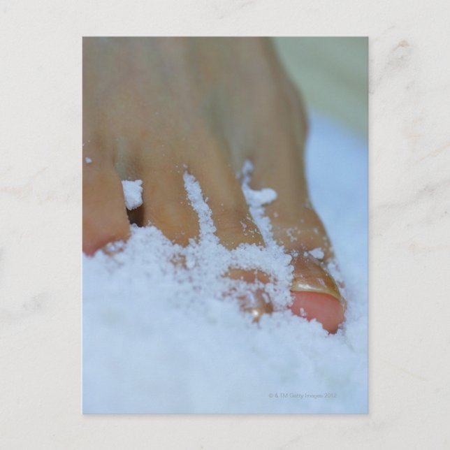 Close-up of a woman's foot in salt postcard (Front)