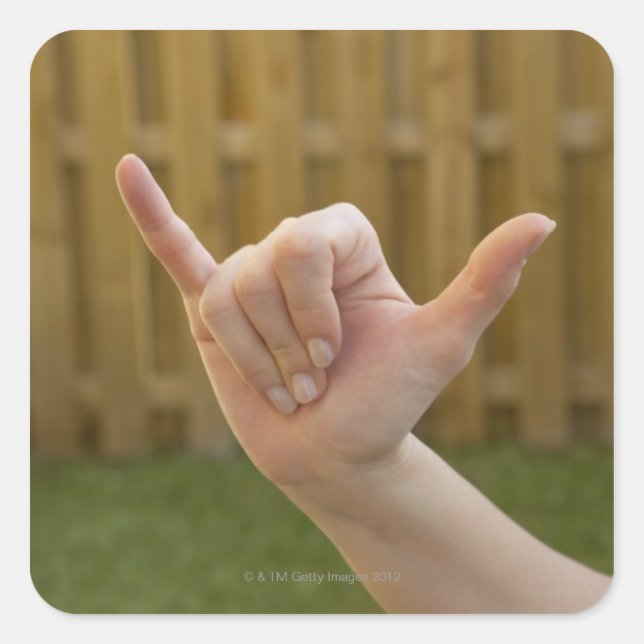 Close-up of a woman's hand making a shaka sign square sticker (Front)