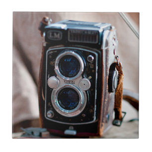 Close-up of an antique camera ceramic tile