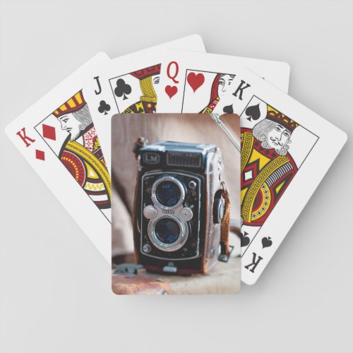 Close_up of an antique camera playing cards