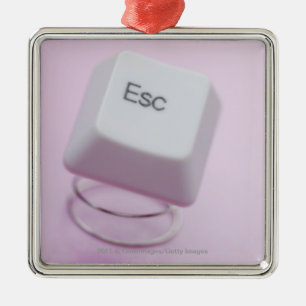 Close-up of an escape key metal ornament