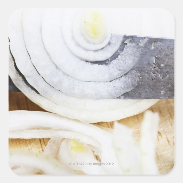 close-up of an onion, being cut into slices square sticker (Front)