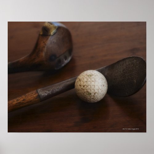 Close up of antique golf clubs and golf ball poster