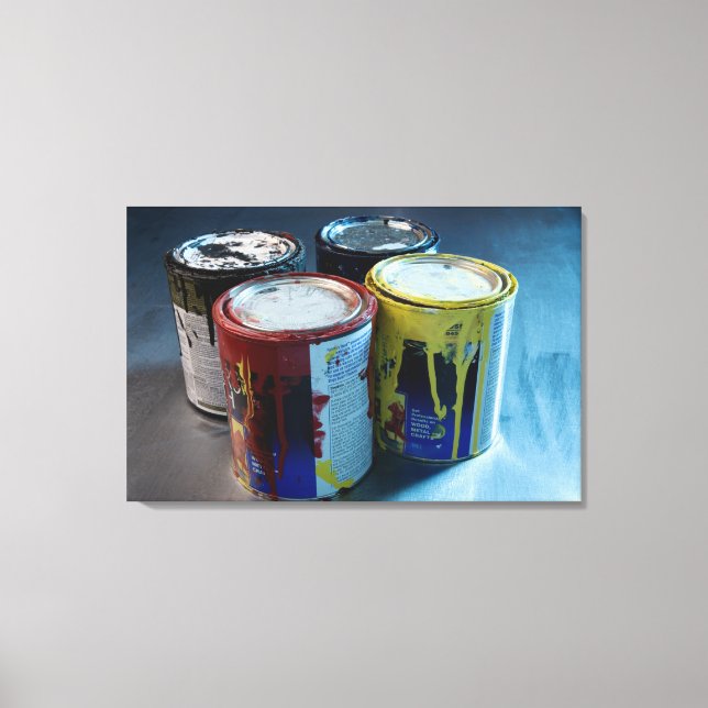 Close-up of four paint cans canvas print (Front)