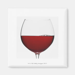 Close up of glass of red wine on white magnet