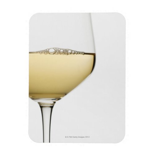 Close up of glass of white wine on white magnet