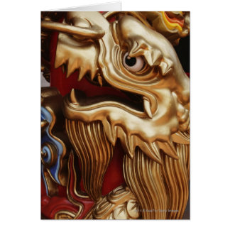 Close up of gold dragon on temple pillar