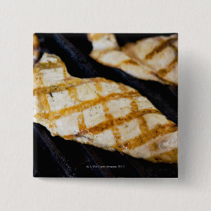 Close-up of grilled chicken breasts pinback button