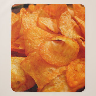 Close up of juicy, crispy, chips on black plate. sherpa blanket