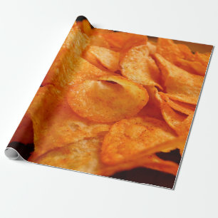 Close up of juicy, crispy, chips on black plate. wrapping paper